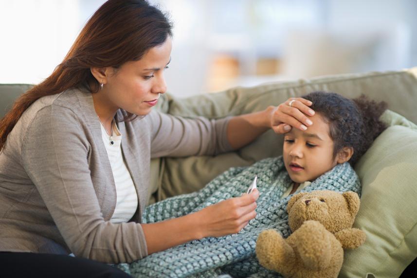 Mother taking care of sick daughter