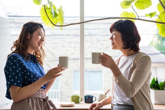 Mother and daughter drinking coffee
